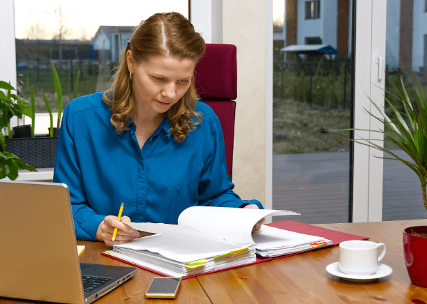 A linguist reviewer compares Portuguese and English pages side by side and delivers Portuguese Translation Services.