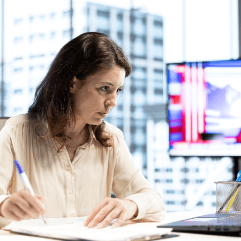 A specialist checks Spanish labels on CAD engineering drawings, using Spanish Translation Services in Miami for technical.