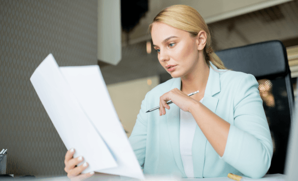 A translator reviews a contract for fast delivery, highlighting Spanish Translation Services in Miami for legal documents.
