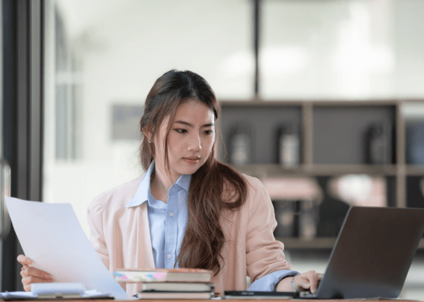 A certified translator prepares a USCIS-ready birth certificate, delivering French Translation Services in Miami.