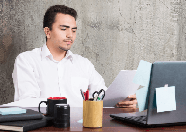 An expert linguist edits a contract draft at a Miami desk for Haitian Creole Translation, with cultural considerations.