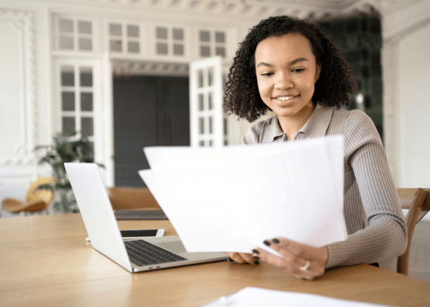 A translation manager runs an ISO quality checklist for Haitian Creole Translation in Miami, confirming legal compliance.