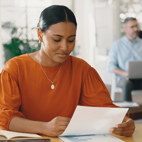 A Miami client reviews a translated affidavit with a specialist from Haitian Creole Translation Services in Miami