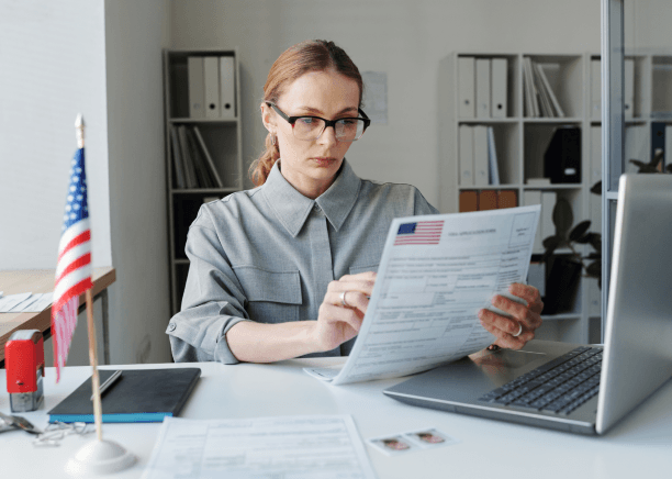 A translator prepares a certified USCIS packet in Miami, using Portuguese Translation Services in Miami for accurate forms.