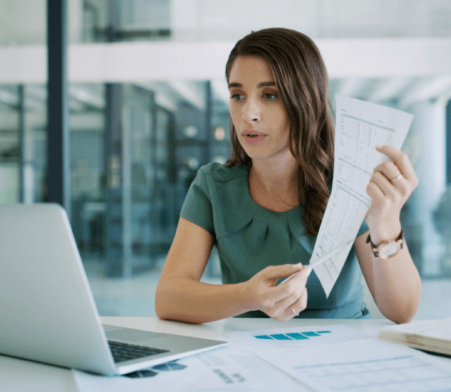 A client reviews scanned IDs and stamps, preparing Spanish Translation Services in Miami with a certified translation.