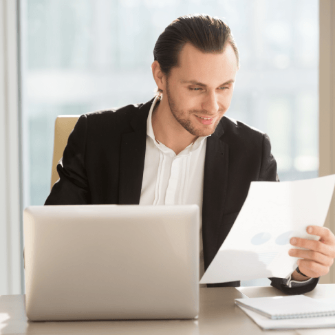 A translator compares an equipment diagram and a glossary as Haitian Creole Translation in Miami handle technical documents.