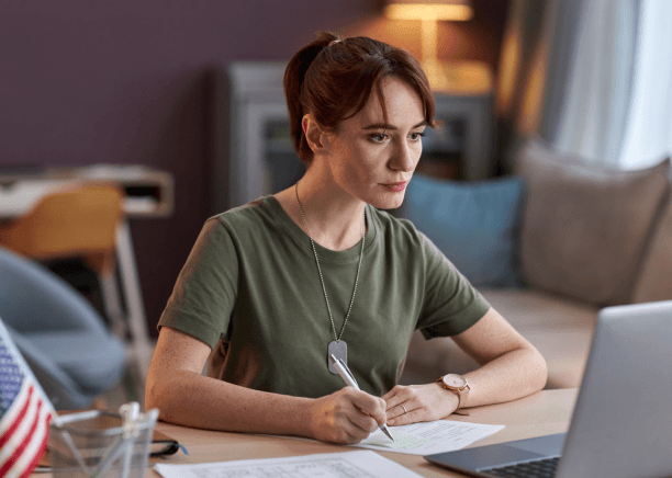 A client reviews a USCIS certified translation checklist beside documents, using Russian Translation Services in Miami.