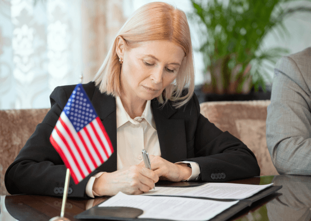 A certified translator stamps and signs a USCIS-certified translation, provided through Spanish Translation Services.